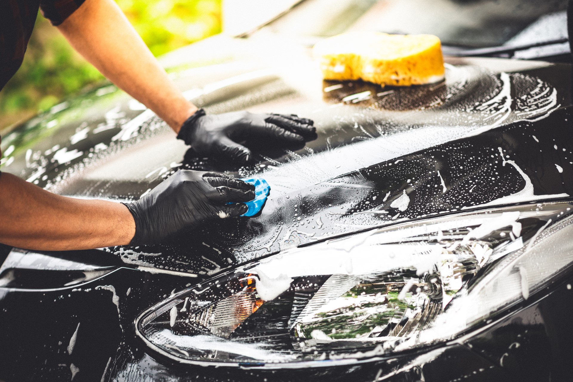 https://colonialcw.com/wp-content/uploads/2021/06/stock-photo-washing-the-black-car-car-cleaning-and-car-care-concept-1445452700.jpg